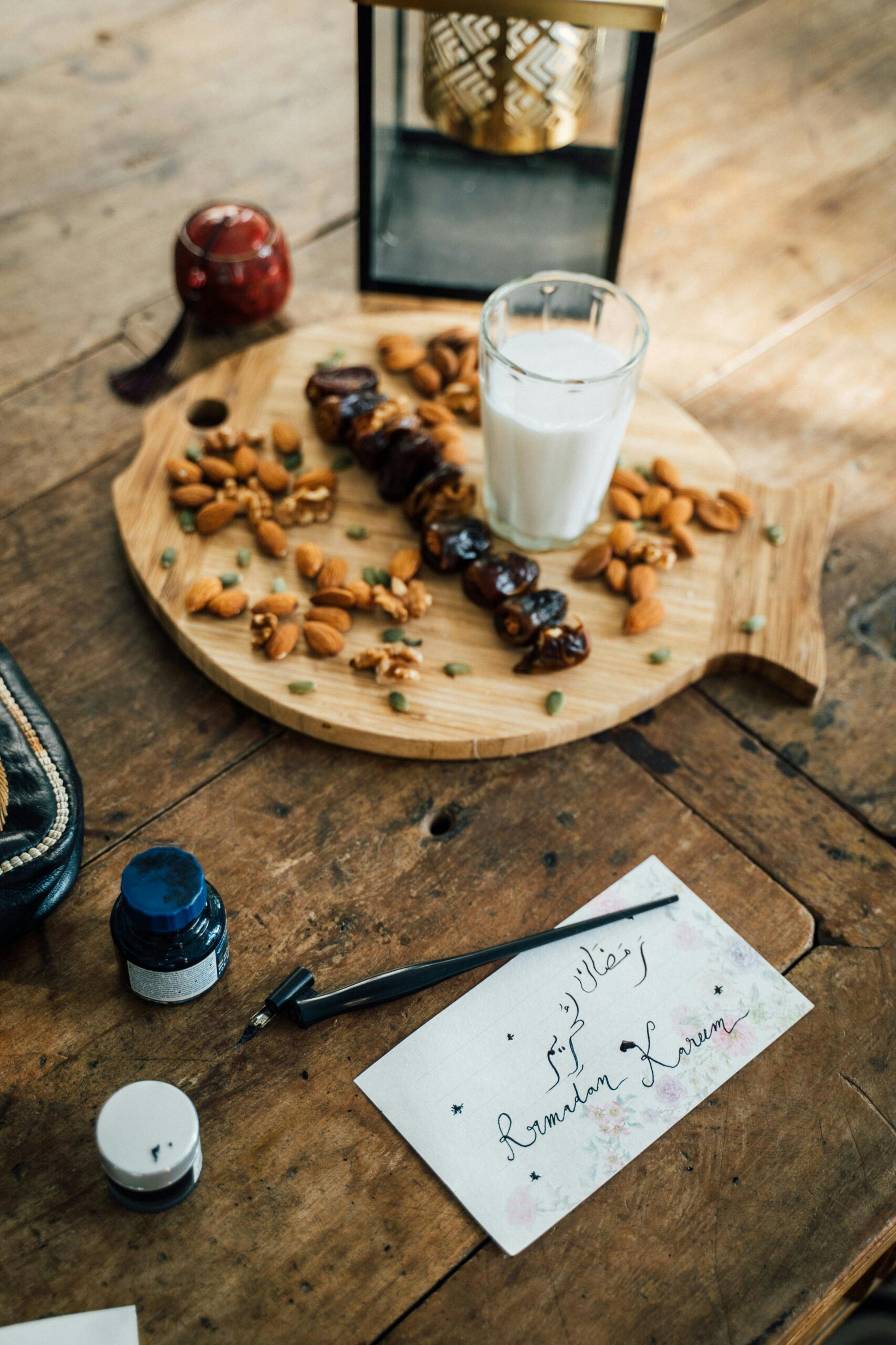 A delightful Ramadan iftar setup with dates, nuts, and a glass of milk on a rustic table.